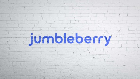 Jumbleberry's logo on a brick wall